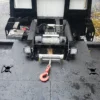 Metro FB-10 flatbed tow truck winch and deck tie-down system close-up