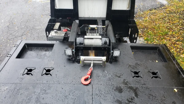 Metro FB-10 flatbed tow truck winch and deck tie-down system close-up