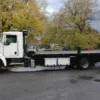 Metro FB-10 flatbed carrier side view parked with autumn background