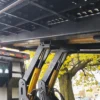 Metro FB-10 flatbed truck hydraulic lift arms and under-deck structure