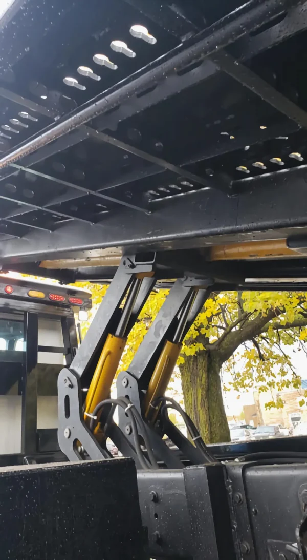 Metro FB-10 flatbed truck hydraulic lift arms and under-deck structure