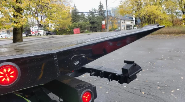 Metro FB-10 rear deck tip with wheel lift and safety lights close-up