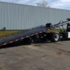 Metro FB-15 flatbed recovery truck with slide-out hydraulic deck extended for loading