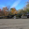 Metro FB-20 extended flatbed deck tilted for loading in outdoor yard