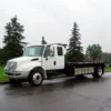 Metro Flatbed FB-5 straight-truck carrier parked roadside ready for vehicle transport