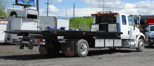 Metro Flatbed FB-5 carrier rear deck with wheel lift and storage compartments