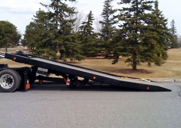 Metro Flatbed FB-5 tow truck tilt deck fully extended for loading