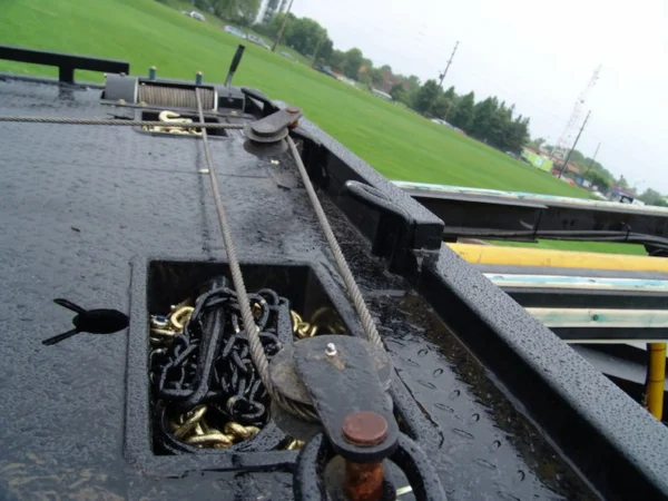 Metro Flatbed FB-5 winch and deck tie-down anchor points close-up