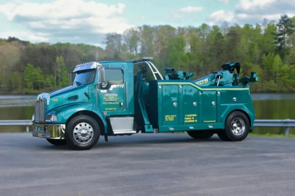 Metro Tow Trucks INT-16 teal heavy-duty integrated wrecker left side view parked on pavement