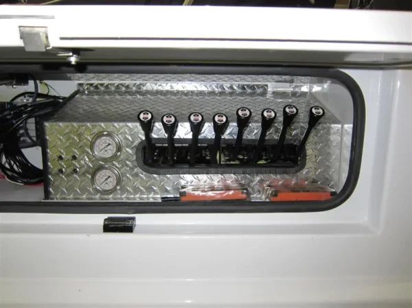 Metro Tow Trucks INT-16 heavy-duty wrecker control panel close-up with hydraulic lever system