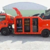 Metro Tow Trucks INT-16 orange heavy-duty integrated wrecker with equipment compartments open in yard