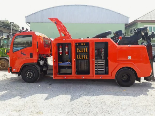 Metro Tow Trucks INT-16 orange heavy-duty integrated wrecker with equipment compartments open in yard