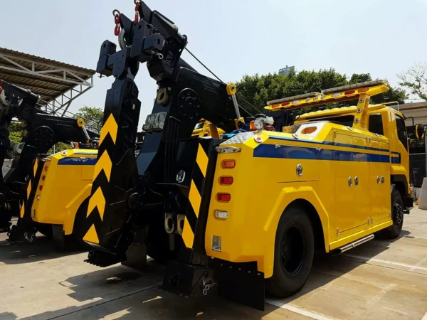 Metro Tow Trucks INT-16 yellow heavy-duty integrated wrecker rear angled view with boom and wheel-lift system