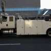 Metro Tow Trucks INT-16 white heavy-duty integrated wrecker left side profile parked beside road