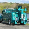 Metro Tow Trucks INT-16 teal heavy-duty integrated wrecker rear view with wheel-lift at roadside