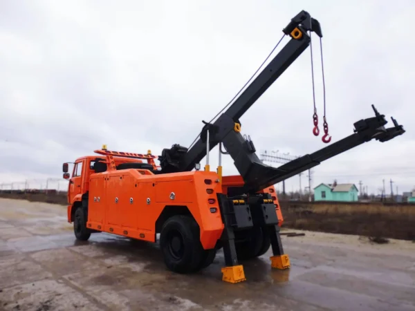 Metro Tow Trucks INT-16 orange integrated wrecker boom extended during lifting operation in yard