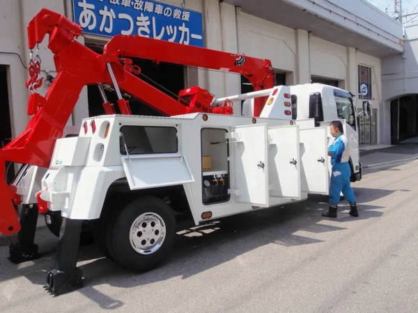 Metro Tow Trucks INT-16 white heavy-duty wrecker rear side view showing body and tool boxes