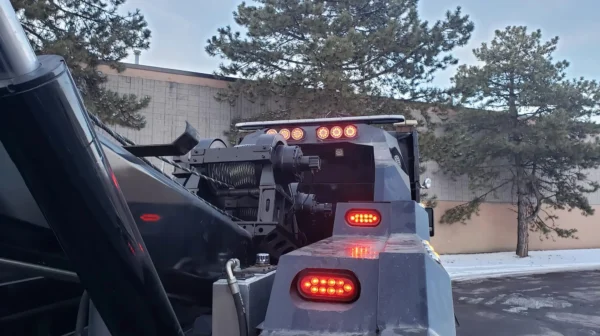 Rear view of INT-35 integrated wrecker showing tow lights and boom hydraulics
