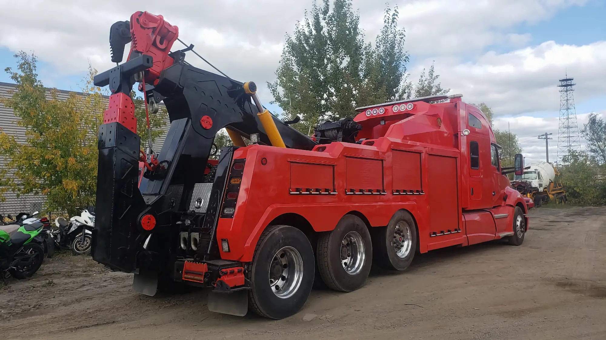 Rear view of red INT-35 heavy-duty wrecker showing underlift and hydraulic boom assembly