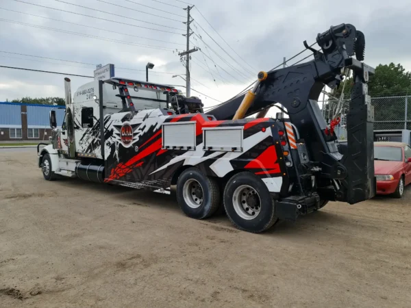 Black and silver INT-35 integrated wrecker showcasing aggressive recovery configuration and winch