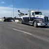 INT-35 heavy-duty tow truck performing roadside recovery of a disabled vehicle on public roadway