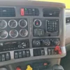 Driver dashboard and recovery control switches inside INT-35 wrecker cab interior