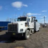 INT-35 heavy-duty wrecker parked in industrial yard with towing equipment visible