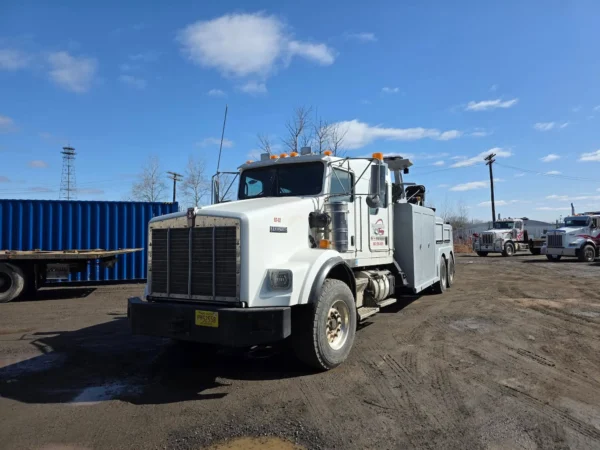 INT-35 heavy-duty wrecker parked in industrial yard with towing equipment visible