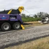 INT-60 integrated wrecker with extended underlift preparing for heavy truck towing operation near roadside