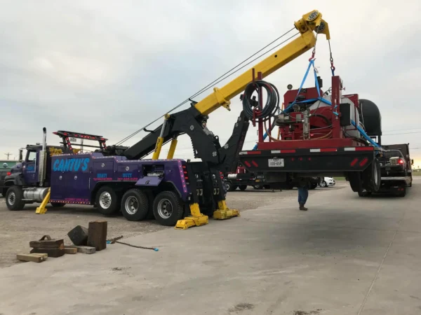 INT-60 heavy duty integrated wrecker supporting a INT-60 heavy duty integrated wrecker supporting a trailer recovery with stabilizers and boom deployed