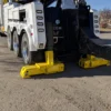 INT-60 heavy duty integrated wrecker with stabilizer legs deployed while preparing for towing operation