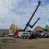 INT-60 heavy duty integrated wrecker operating rear telescopic boom during commercial truck recovery setup
