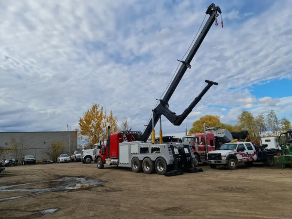 INT-60 heavy duty integrated wrecker operating rear telescopic boom during commercial truck recovery setup