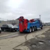 INT-60 heavy duty integrated wrecker providing breakdown towing service at an industrial recovery location