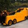 Rear right view of yellow INT-60 integrated wrecker