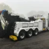 INT-60 integrated wrecker in white with rear boom deployed for heavy vehicle towing duty