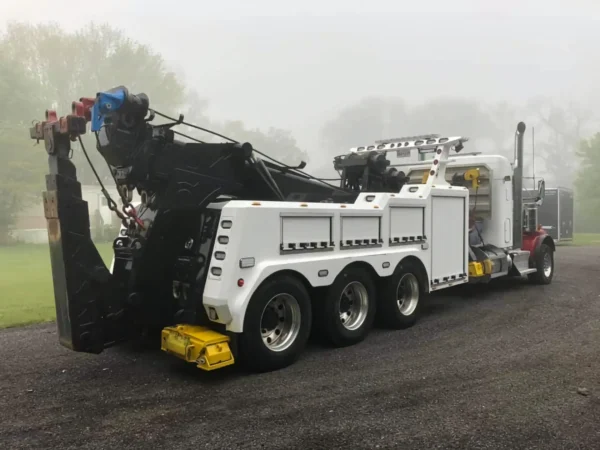 INT-60 integrated wrecker in white with rear boom deployed for heavy vehicle towing duty