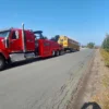 Red INT-60 heavy duty wrecker towing a yellow school bus