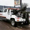 Metro Tow Trucks INT-5 white integrated wrecker angled view on roadside
