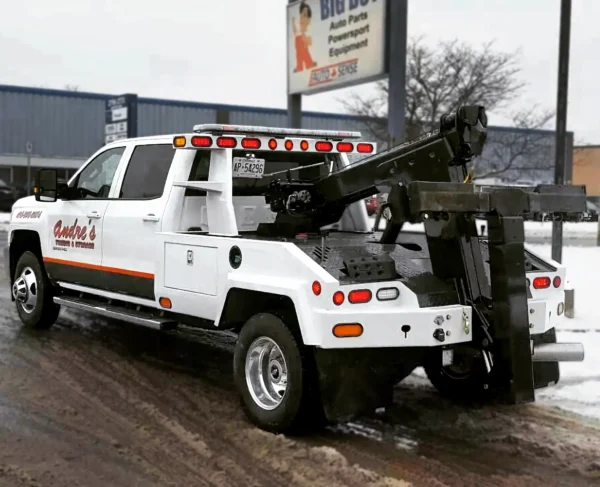 Metro Tow Trucks INT-5 white integrated wrecker angled view on roadside