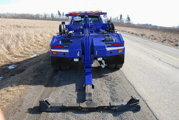 Metro Tow Trucks INT-5 blue rear view underlift extended in working position