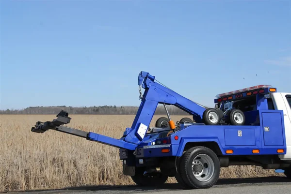 Metro Tow Trucks INT-5 blue underlift extension in operation roadside