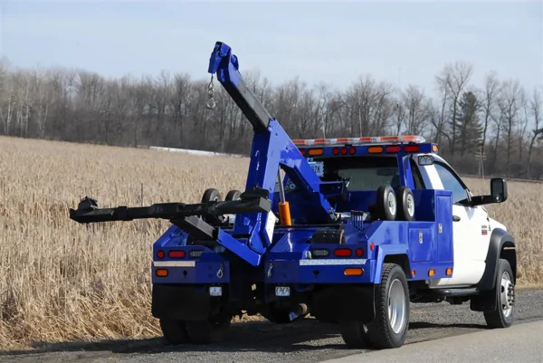 Metro Tow Trucks INT-5 blue integrated tow truck rear angled view with wheel-lift extended