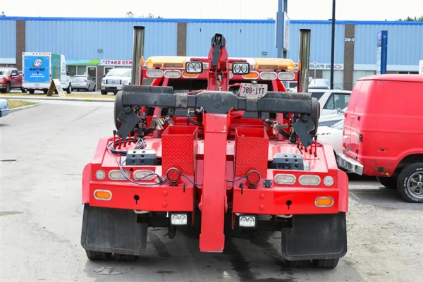 Metro Tow Trucks INT-5 red wrecker rear tow system close-up with wheel-lift