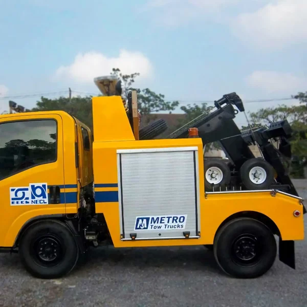 Yellow INT-5 tow truck right side profile