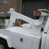 Metro Tow Trucks INT-5 white underlift detail with hydraulic system and pivots