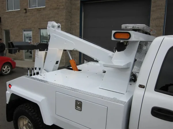 Metro Tow Trucks INT-5 white underlift detail with hydraulic system and pivots