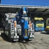 Metro Tow Trucks INT-30 heavy-duty integrated wrecker rear view with blue underlift system in service yard