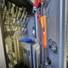 Metro Tow Trucks INT-30 equipment storage compartment open showing towing accessories and tools