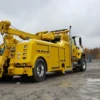 Yellow RTR-16 rotator recovery truck positioned for heavy lifting rescue work